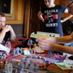 Amy Vorpahl standing over the group table for D&D