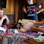 Amy Vorpahl standing over the group table for D&D