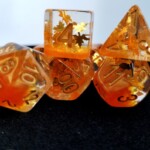 autumn dice clear on top and orange at bottom with foil leaves in the middle