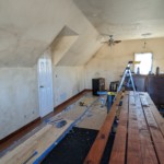 Still staining boards as we nailed them to the wall