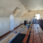 Still staining boards as we nailed them to the wall