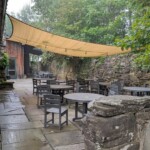 Back patio for the "barn" where we often had appetizers and conducted our book club meeting Back patio with a slate and rock rustic feel
