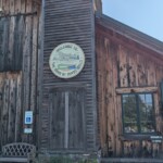 The "barn" main conference and dining hall Exterior of the 'barn' with a rustic wood exterior