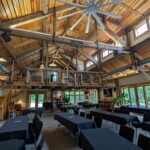 Inside the "barn" is just gorgeous and spacious with a great writing loft Interior of the "barn" with rustic wood beams and a writing loft; meeting tables along the bottom floor