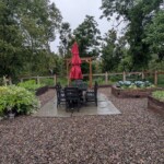 One of the herb gardens I saw, which the kitchen staff uses for its meals Herb garden with a red umbrella in the middle