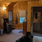 Interior of a small writing cabin featuring the door